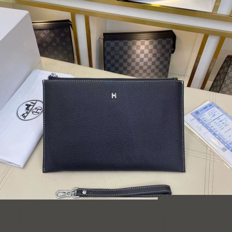 H**mes clutch bags